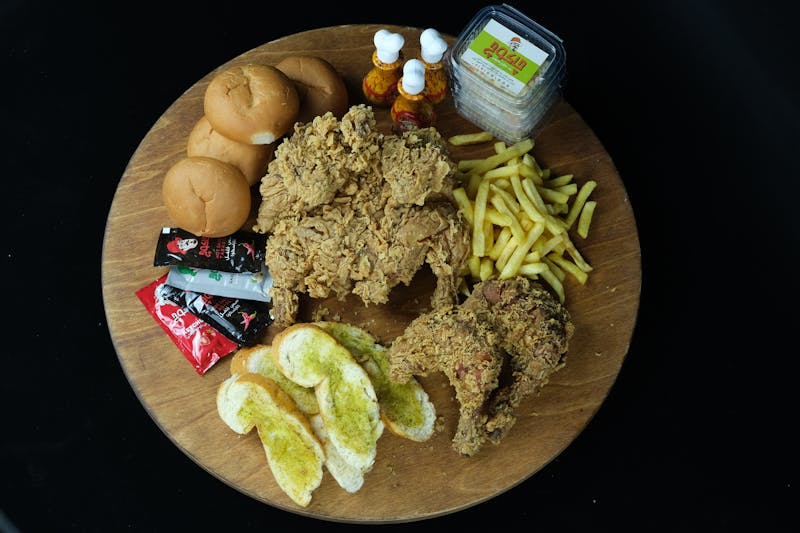 Plated fried chicken meal for catering