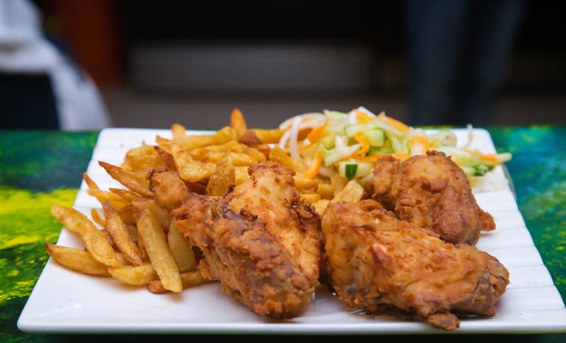 Church's Chicken kitchen team preparing fresh fried chicken with care